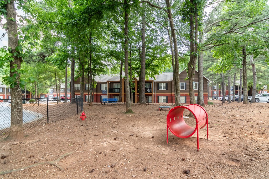 Pet park with agility features at Flats at River View apartments in Duluth, GA, near Lawrenceville.