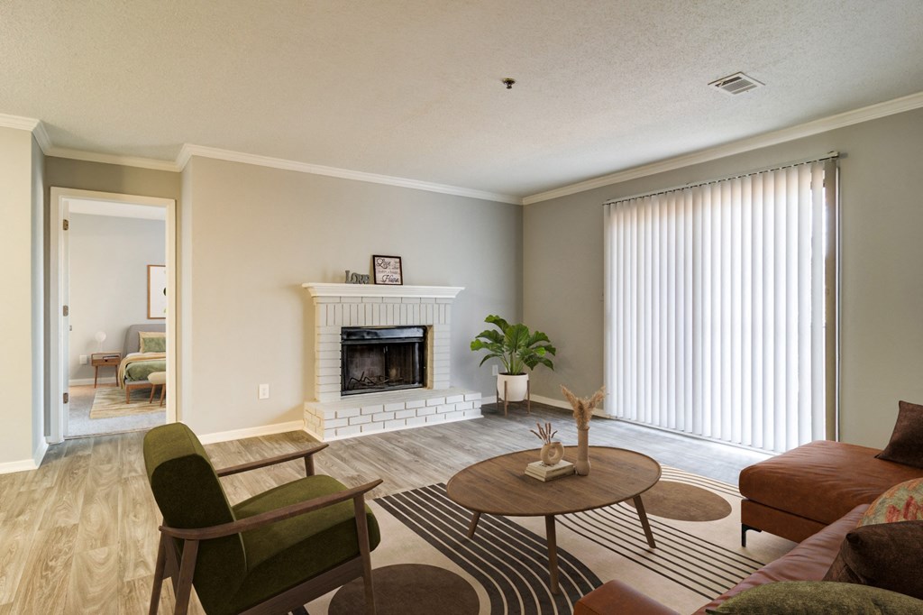 Living room with cozy fireplace at Forest Glen apartments in Austell, GA 30106, near South Cobb County and Douglasville.