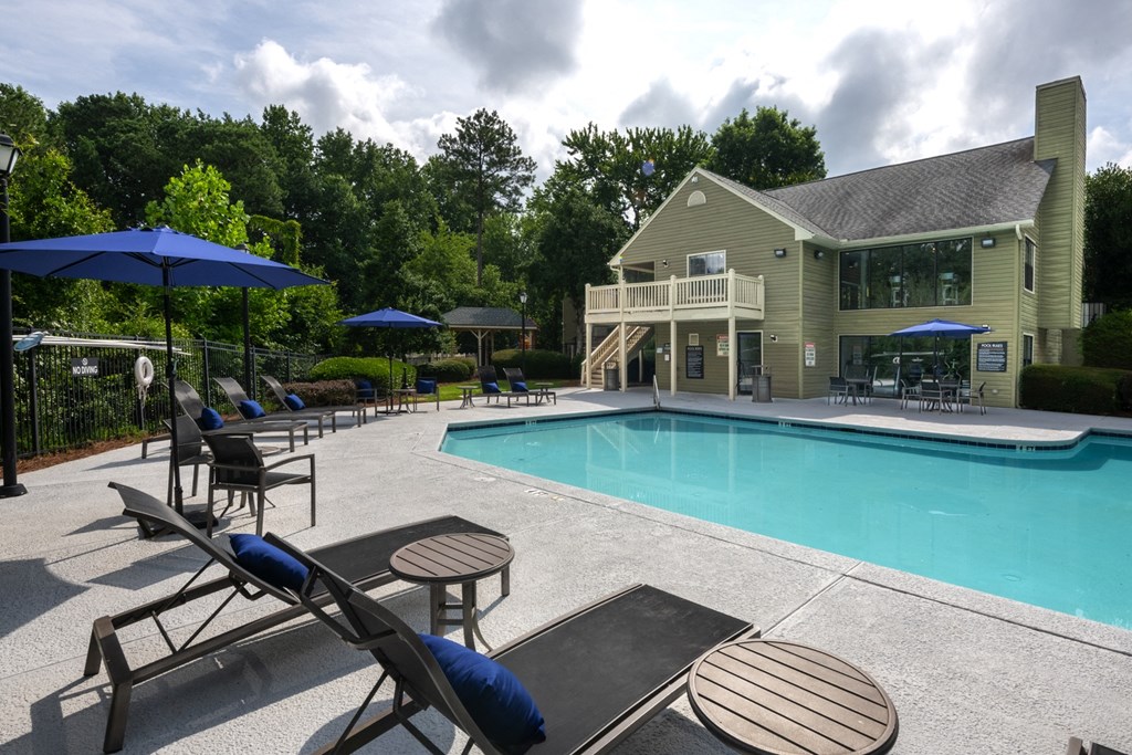 Swimming pool with lounge seating at Forest Glen apartments in Austell, GA 30106, near South Cobb County and Douglasville.