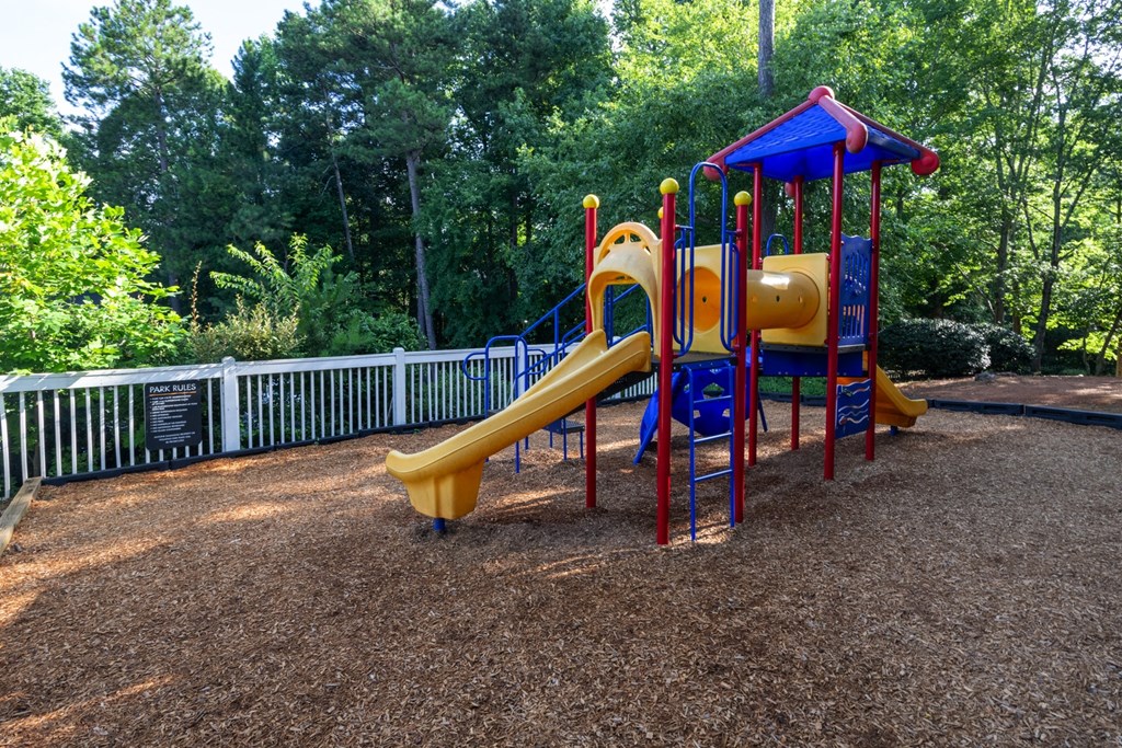 Playground with safe play structures at Forest Glen apartments in Austell, GA 30106, near South Cobb County and Douglasville.