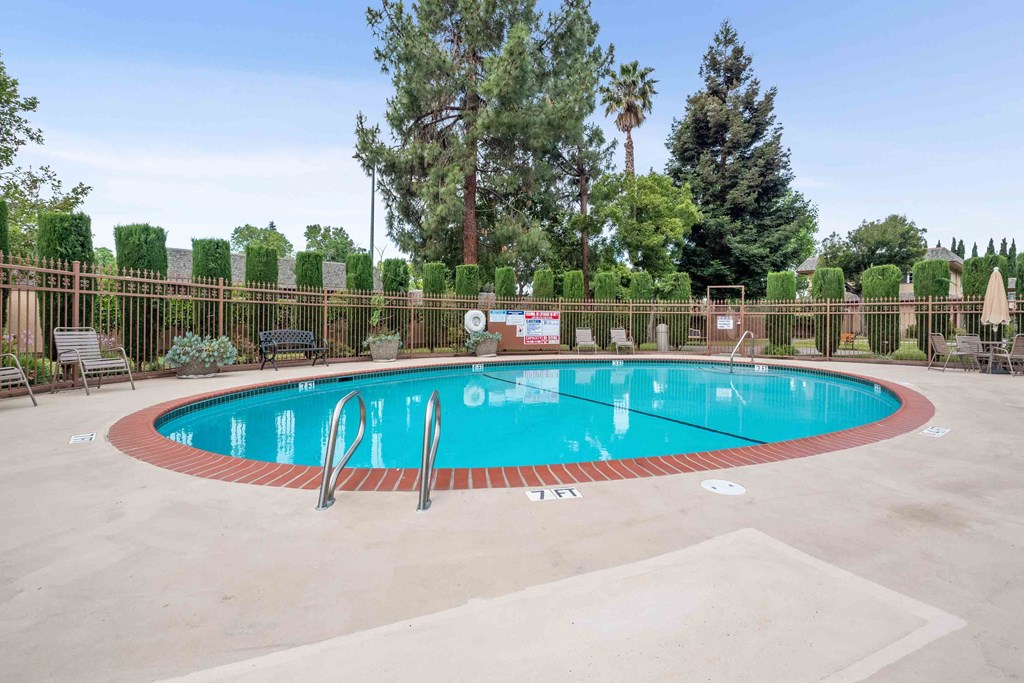 a swimming pool with a fence around it