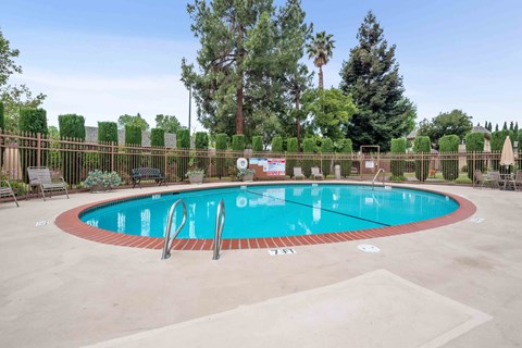 a swimming pool with a fence around it