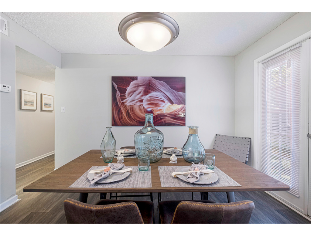 Dining room with a large window and abundant natural light at Springdale Glen, a pet-friendly community in Clarkston, GA, near Decatur.