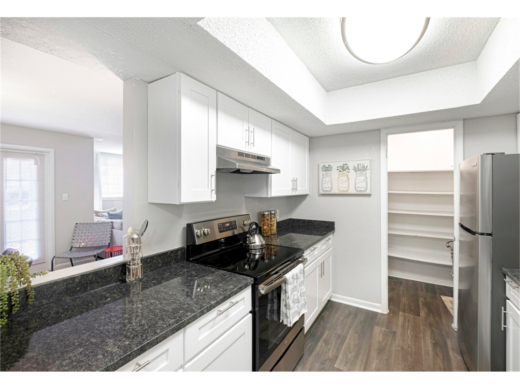 Spacious kitchen with a large pantry at Springdale Glen, a pet-friendly community in Clarkston, GA, near Decatur.