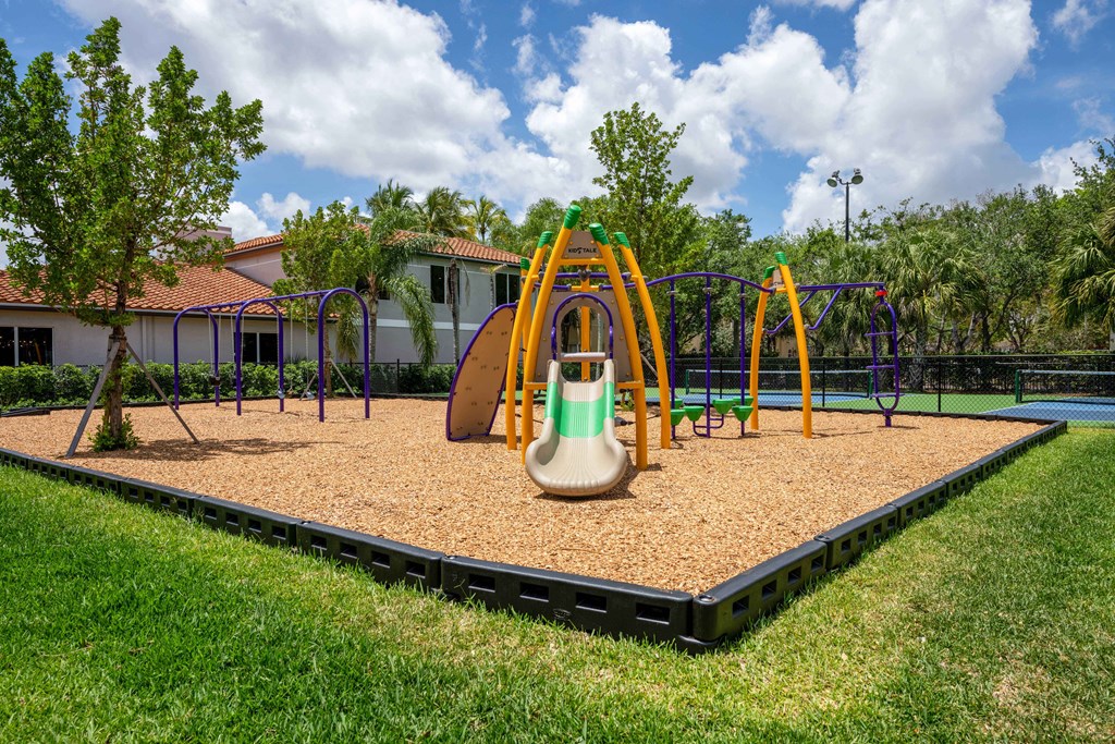 Gatehouse on the Green Apartments in Plantation, FL photo of a playground with a swing set and slides