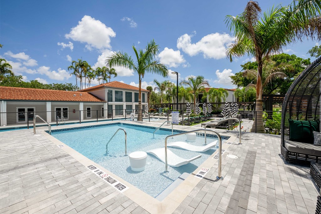 Gatehouse on the Green Apartments in Plantation, FL photo of a swimming pool with chairs