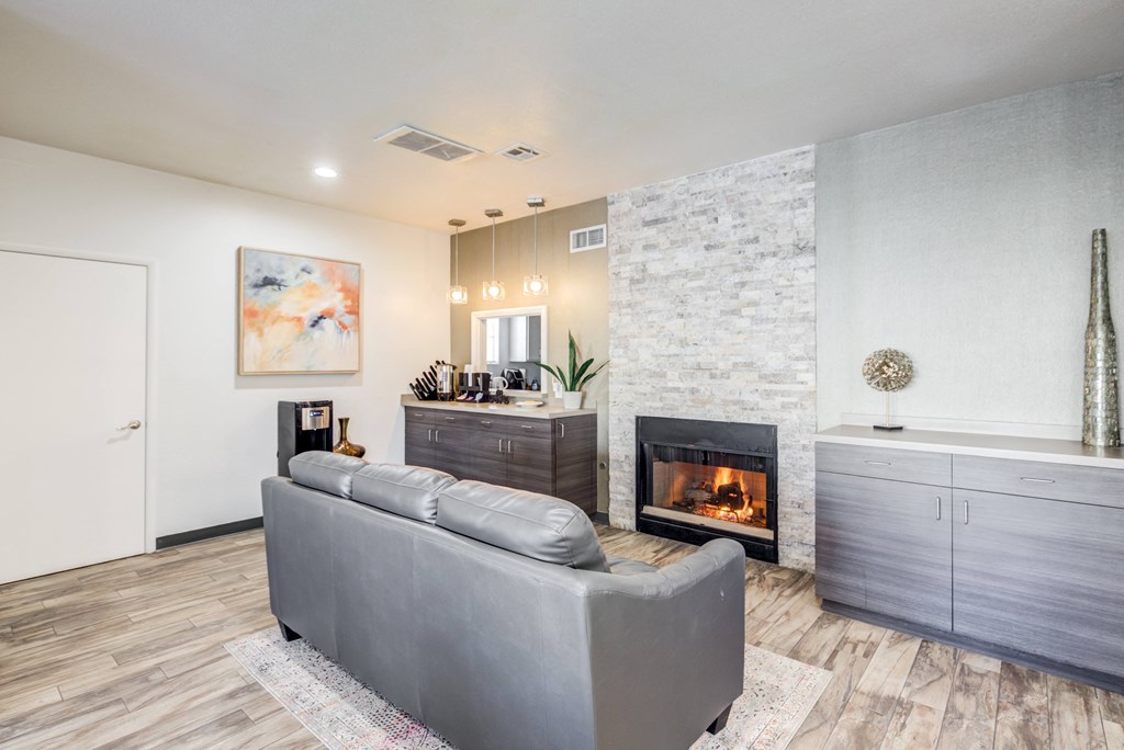a living room with a couch and a fireplace