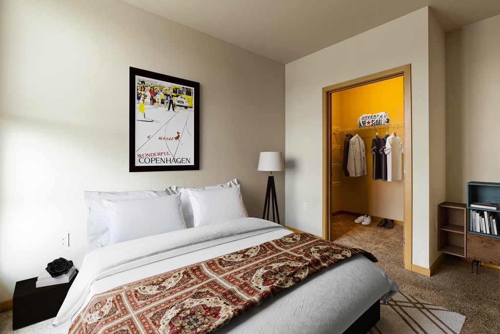 a bedroom with a bed and a closet