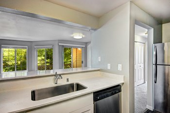 renovated unit kitchen features stainless steel appliances - Photo Gallery 5