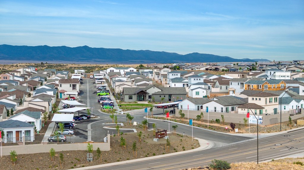A suburban neighborhood with houses and a road.