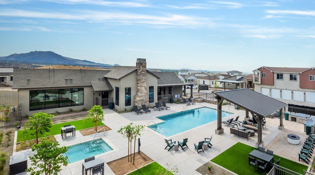 A large house with a pool in the backyard.