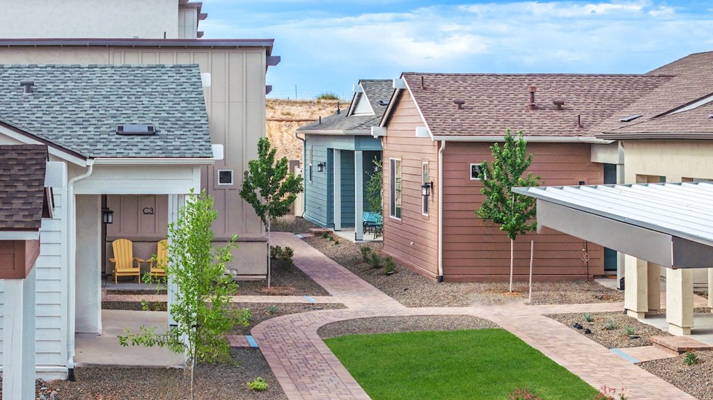A residential area with houses and a clear sky.