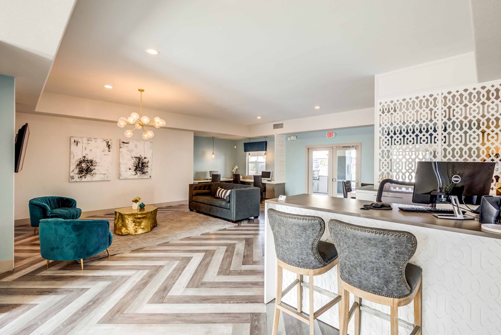 a living room with a kitchen and a couch