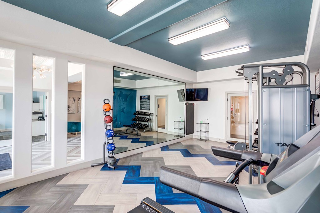 the gym at the district flats apartments in lenexa