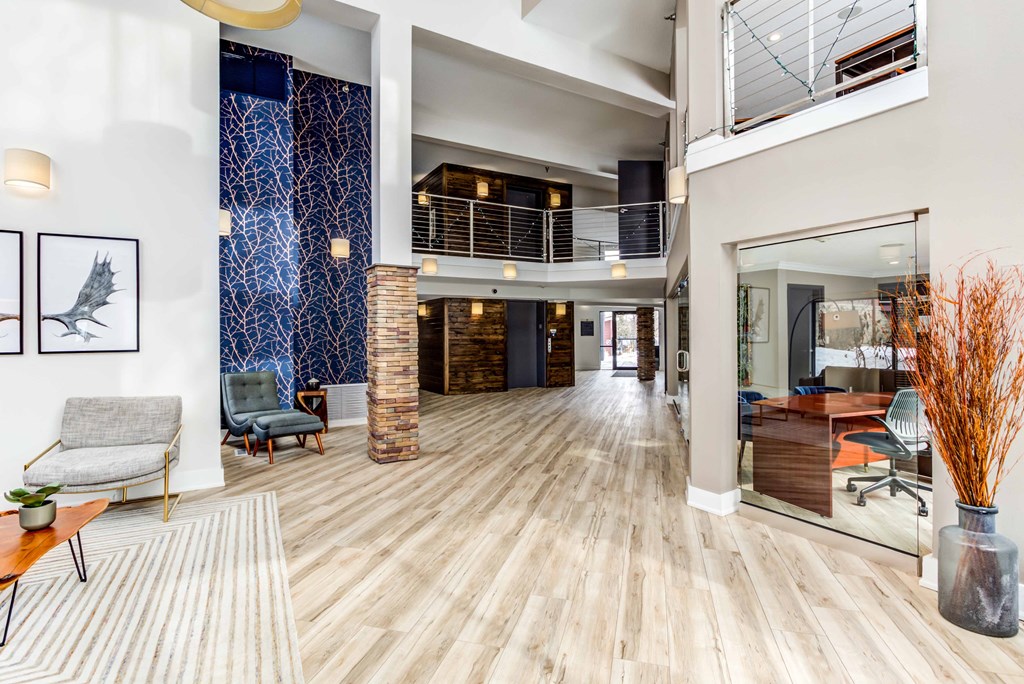the lobby of a house with a large lobby area and a glass door