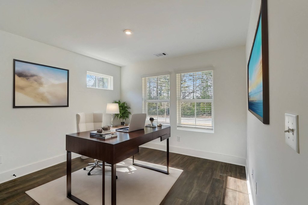 Large and spacious bedroom with a big window in pet-friendly townhomes at Henley Avondale in Avondale Estates, GA.