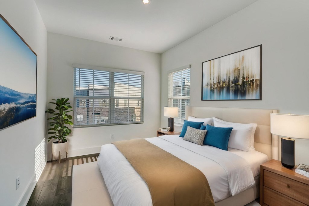 Bedroom with large windows in pet-friendly townhomes at Henley Avondale in Avondale Estates, GA.