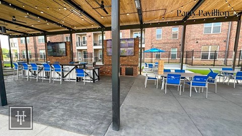 Heritage Towers Apartments a patio area with tables and chairs and a television on the wall lewisville tx apartments apartments near lewisville tx lewisville apartments