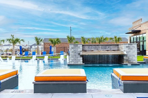 the swimming pool at the heritage village resort and spa