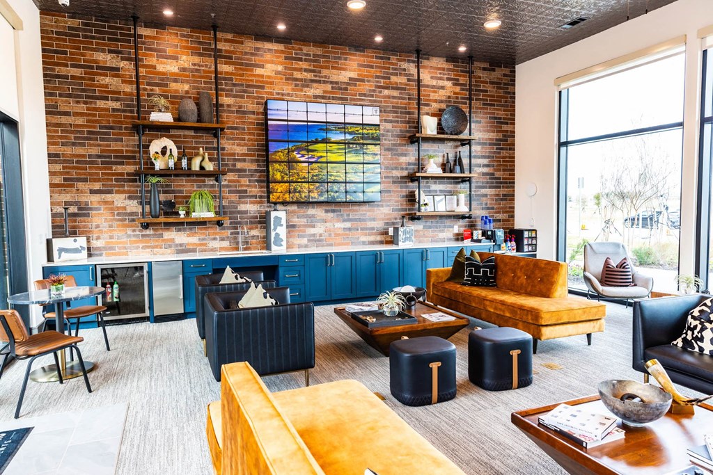 a living room filled with furniture and a large window