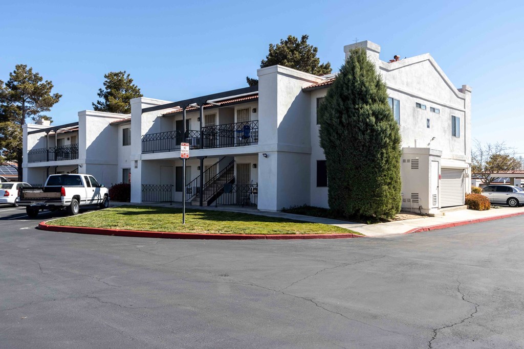 High Desert Villas apartments in Victorville California a white apartment building with a parking lot