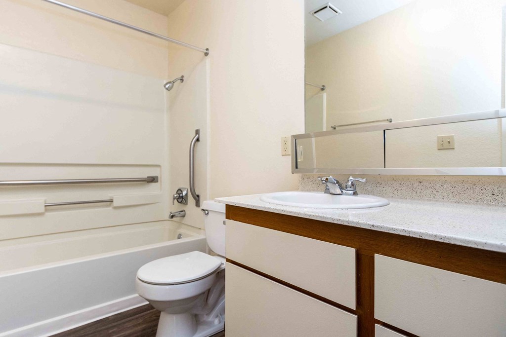 High Desert Villas apartments in Victorville California spacious bathroom with a sink toilet and a bath tub