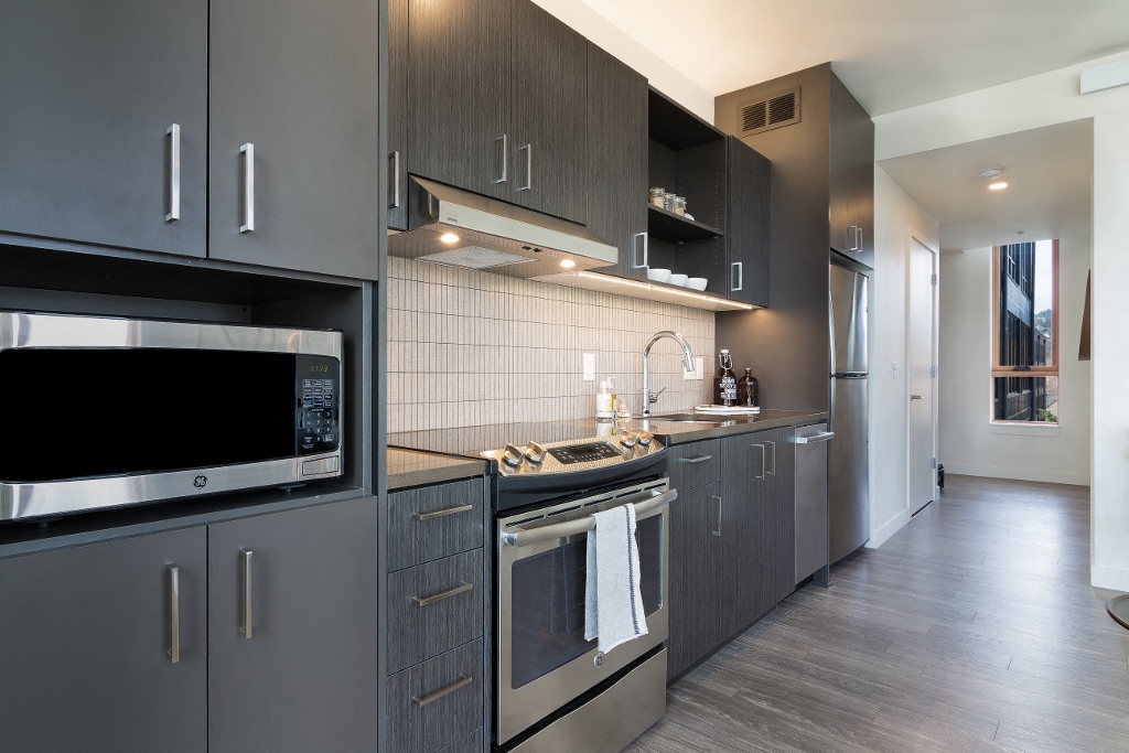 Apartments For Rent In NW, Portland - The Muse -
Chef-Inspired-Kitchen With Quartz Countertops, Porcelain Tile Backsplashes, And Stainless Steel Appliances