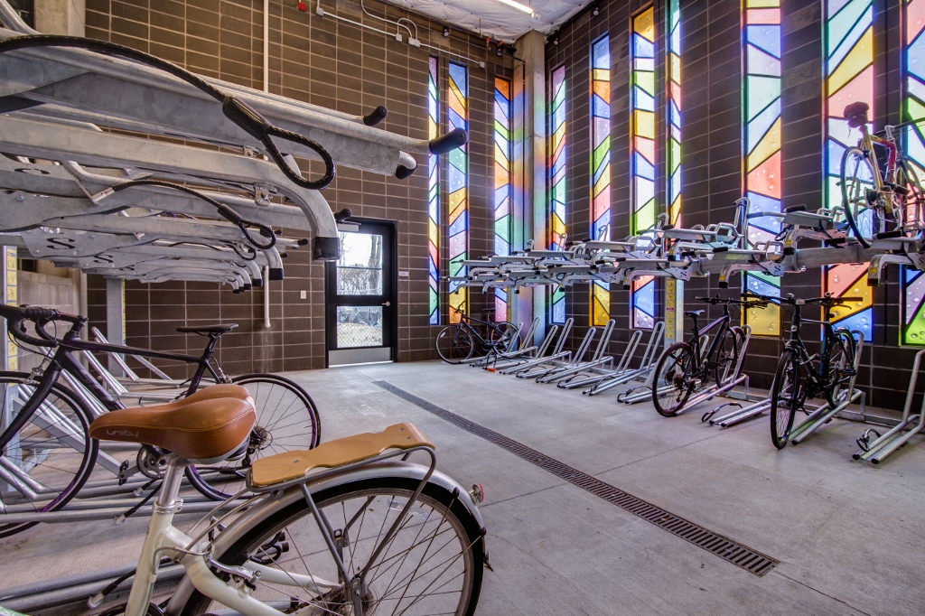Apartments in Portland, OR - Muse Apartments Bike Storage Center With Numerous Racks and Beautiful Stained Glass Windows
