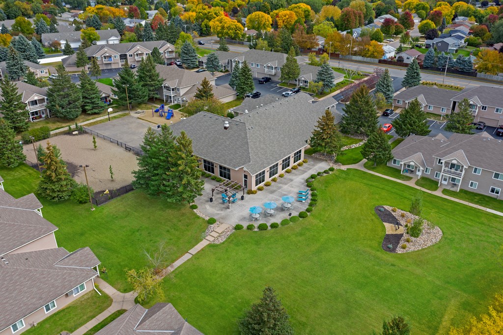 Hinton Height_Cottage Grove_MN_an aerial view of a neighborhood with houses and a swimming pool