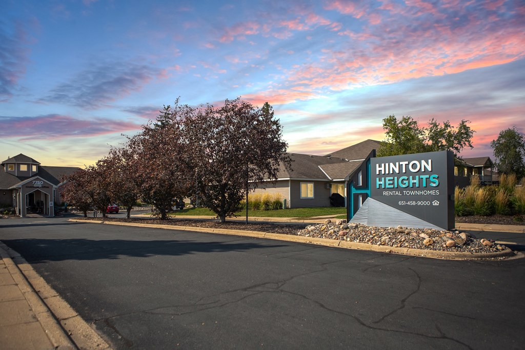 Hinton Height_Cottage Grove_MN_the sign at the entrance to the community under a colorful sky