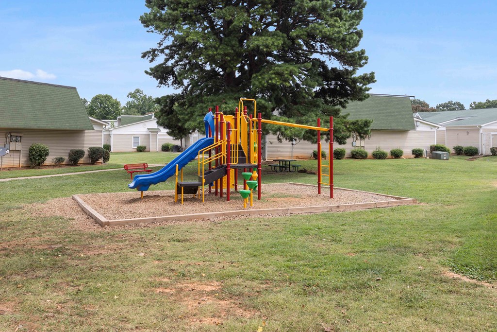 Community playground with safe play equipment at Hunters Pointe apartments in Charlotte, NC 28213, near UNC Charlotte.