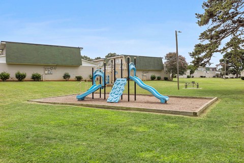 Community playground with safe play structures at Hunters Pointe apartments in Charlotte, NC 28213, near UNC Charlotte.