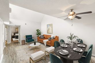 Hunters Pointe Apartments in Charlotte North Carolina photo of a living room and dining room with a ceiling fan and hardwood floors - Photo Gallery