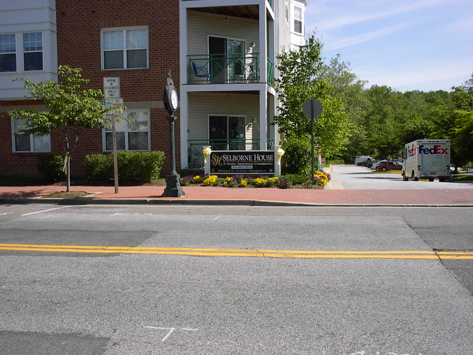 A street view of Selborne House with a FedEx truck in the background.