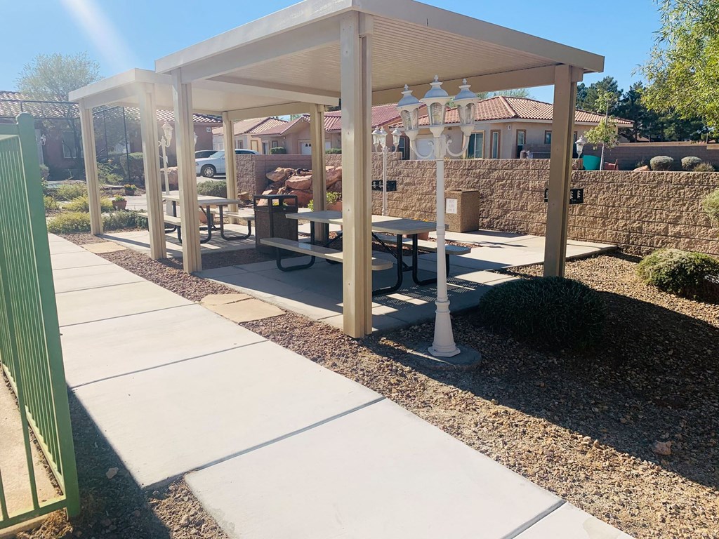 a picnic area with benches and a pavilion