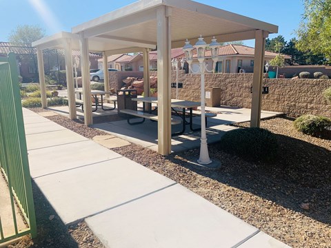 a picnic area with benches and a pavilion