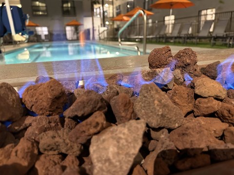 rocks and water in front of a swimming pool