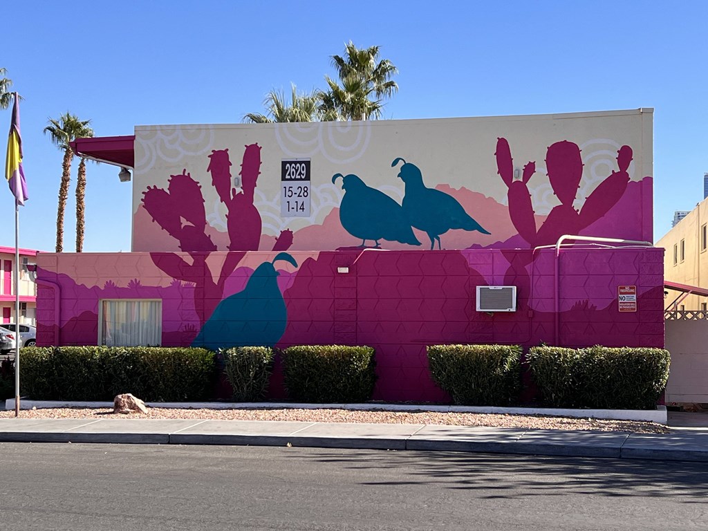 a mural of birds on the side of a building