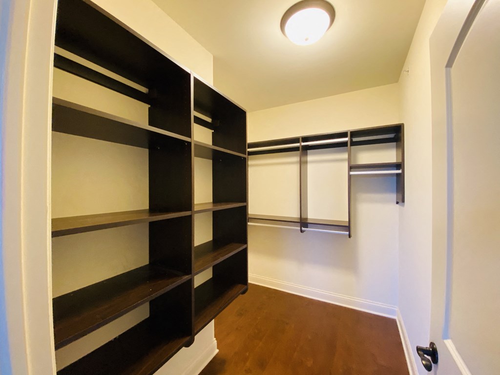 a walk in closet in a 555 waverly unit
