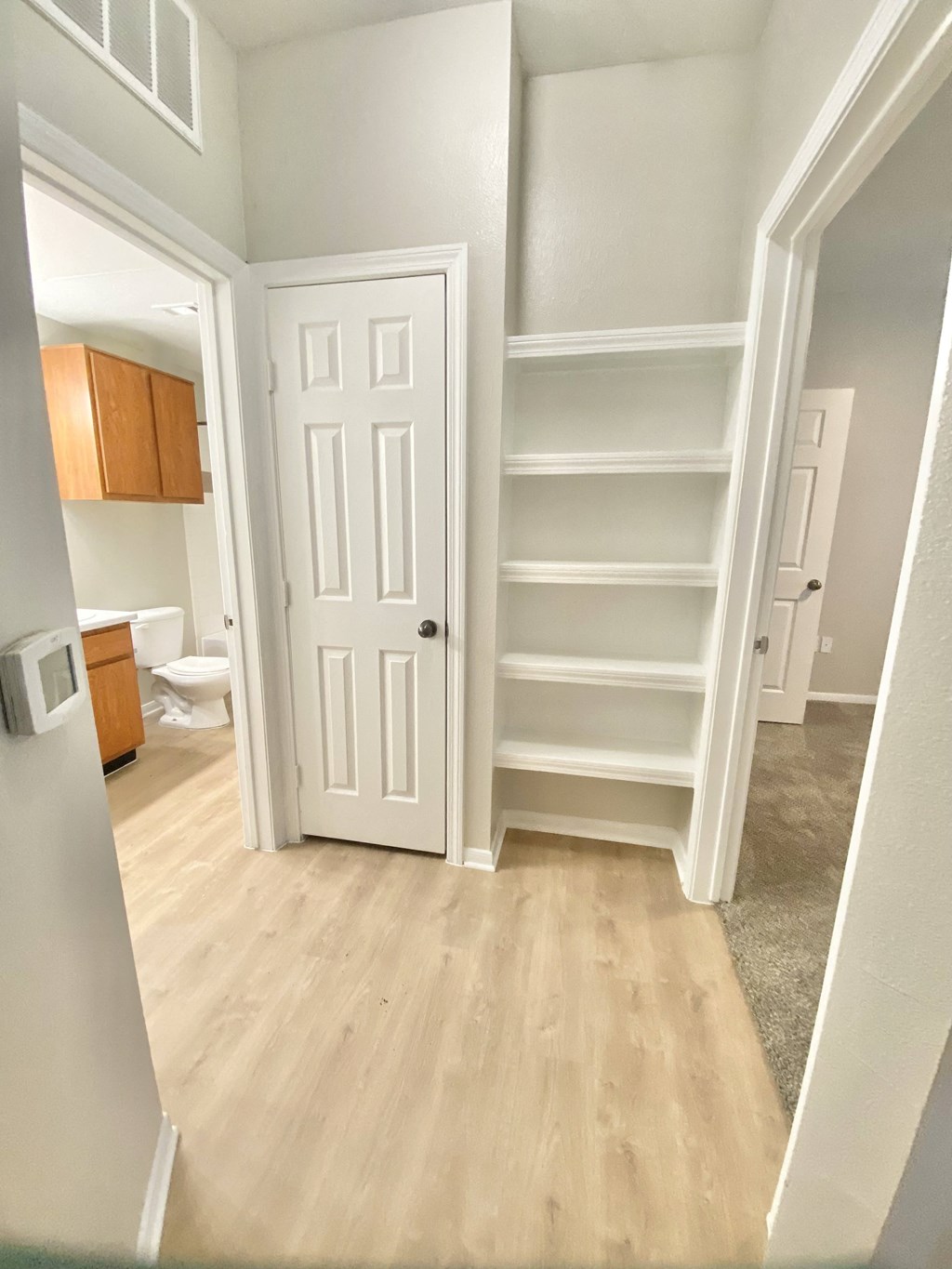 Room connecting space with storage and door