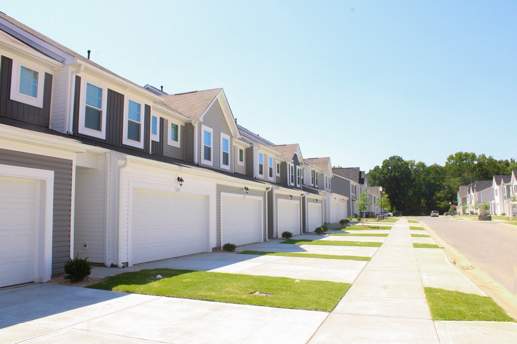 a row of houses on the side of a street
