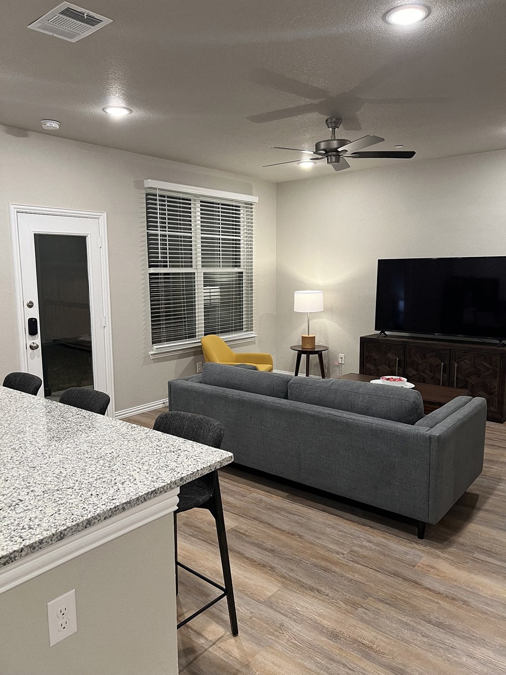 a living room with a couch and a tv