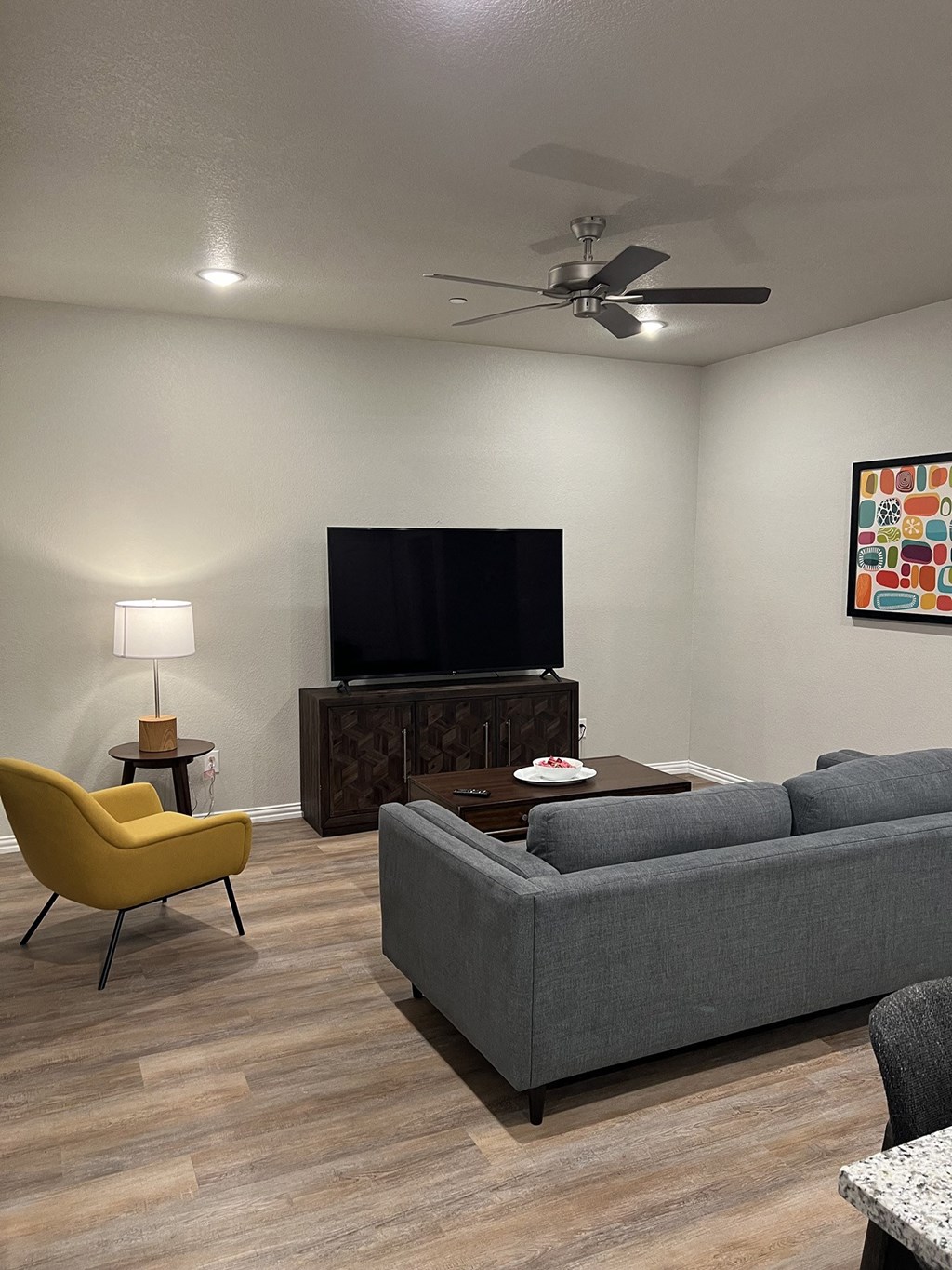 a living room with a couch and a tv