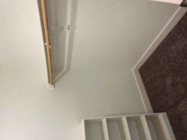 a room with a white ceiling and a door that is open