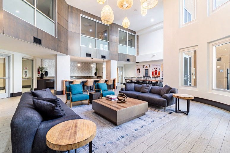 2-Bedroom Apartments in Milpitas, CA - Ilara Apartments - Lounge with Couch Seating, Bar-Top Seating, and a Kitchenette