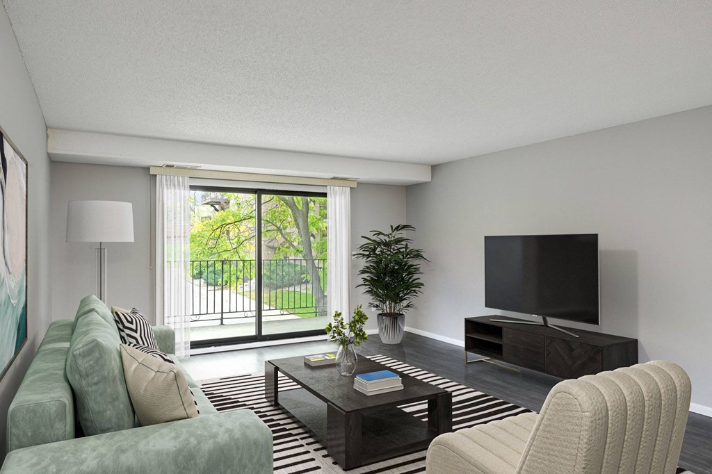 Laurel West End Apartments in Golden Valley, MN photo of a living room with a large window and a sliding glass door