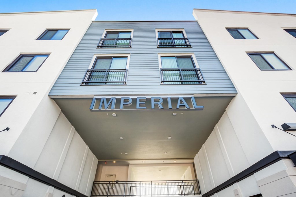 the facade of an apartment building with the word imperial on it