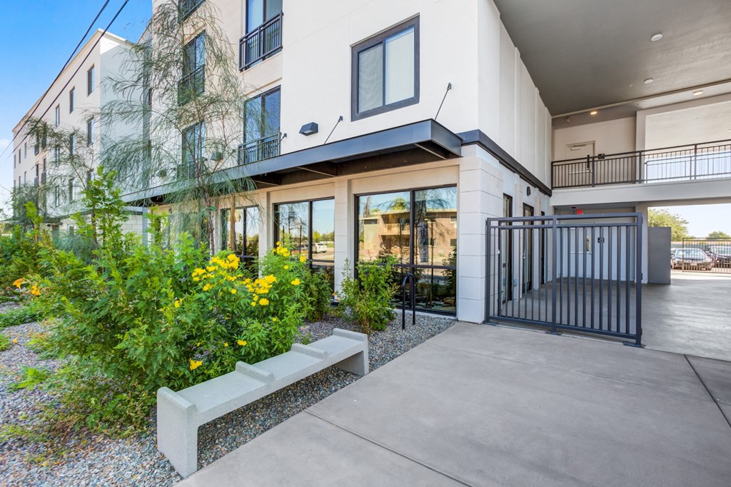 the preserve at ballantyne commons apartments entrance with sidewalk and plants