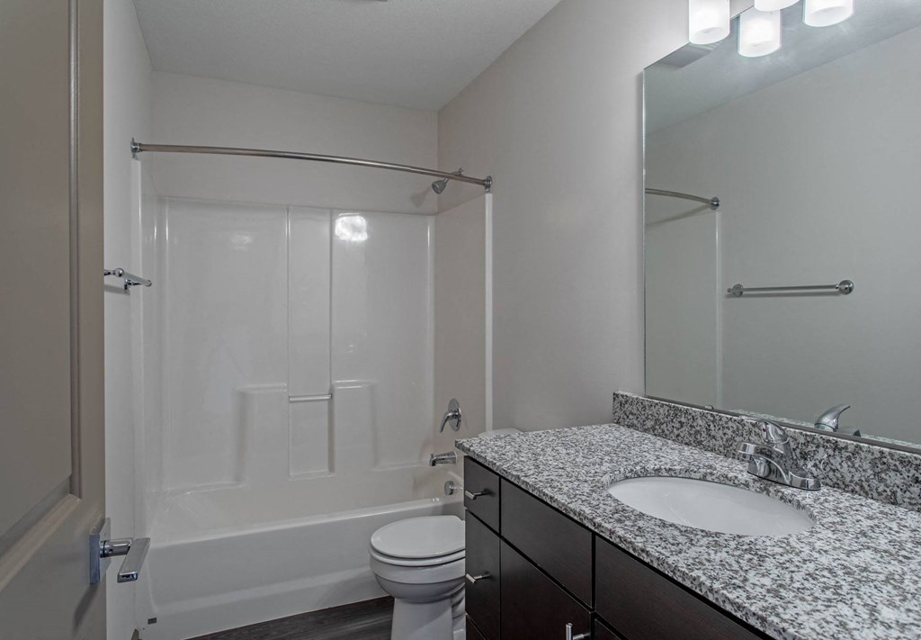 a bathroom with a bathtub and a sink