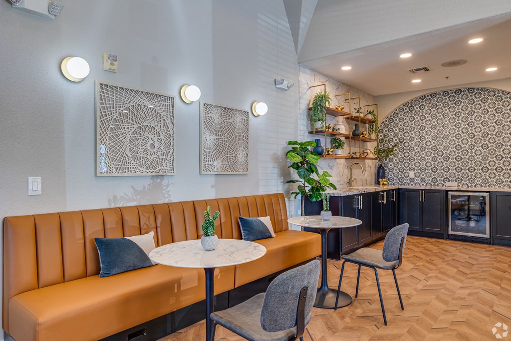 A modern dining area with a round table and chairs.